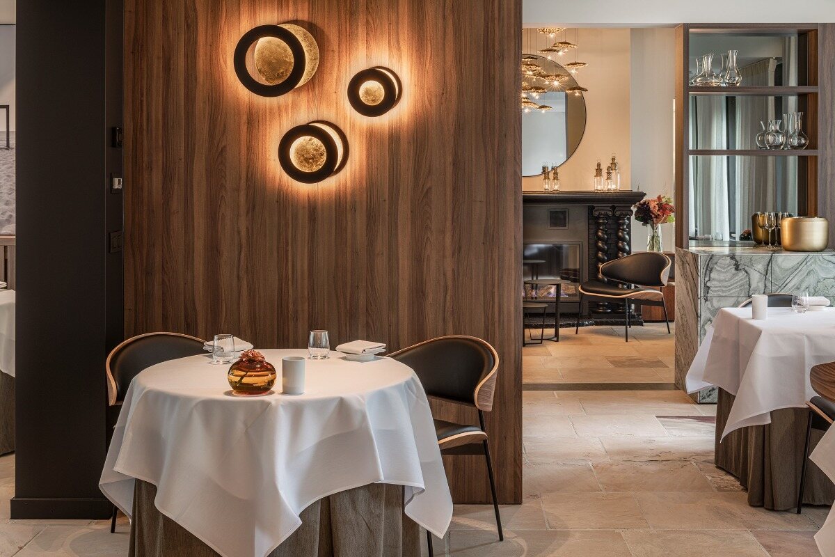Dining room with sculptural lighting and lounge at Restaurant De Jonkman